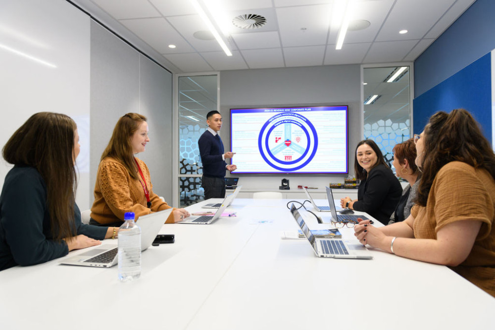 NSW Government employees meeting in a board room