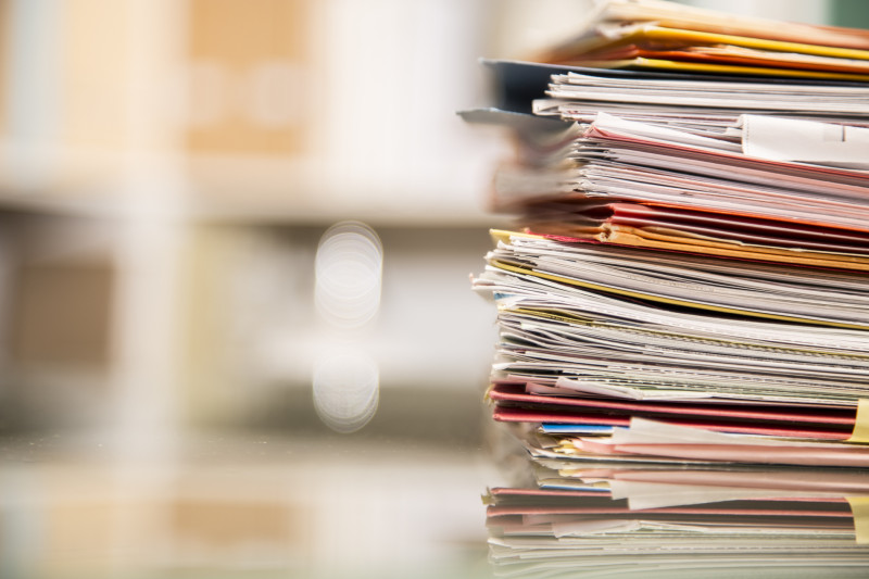 A stack of papers on a desk