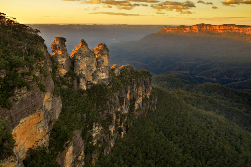 The sun rising over the blue mountains