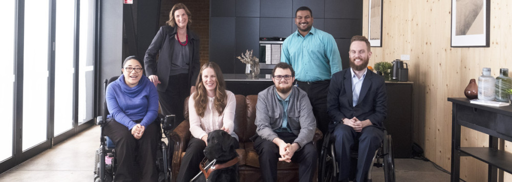 Disability advocates in a group smiling at the camera