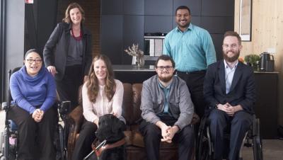 Disability advocates in a group smiling at the camera